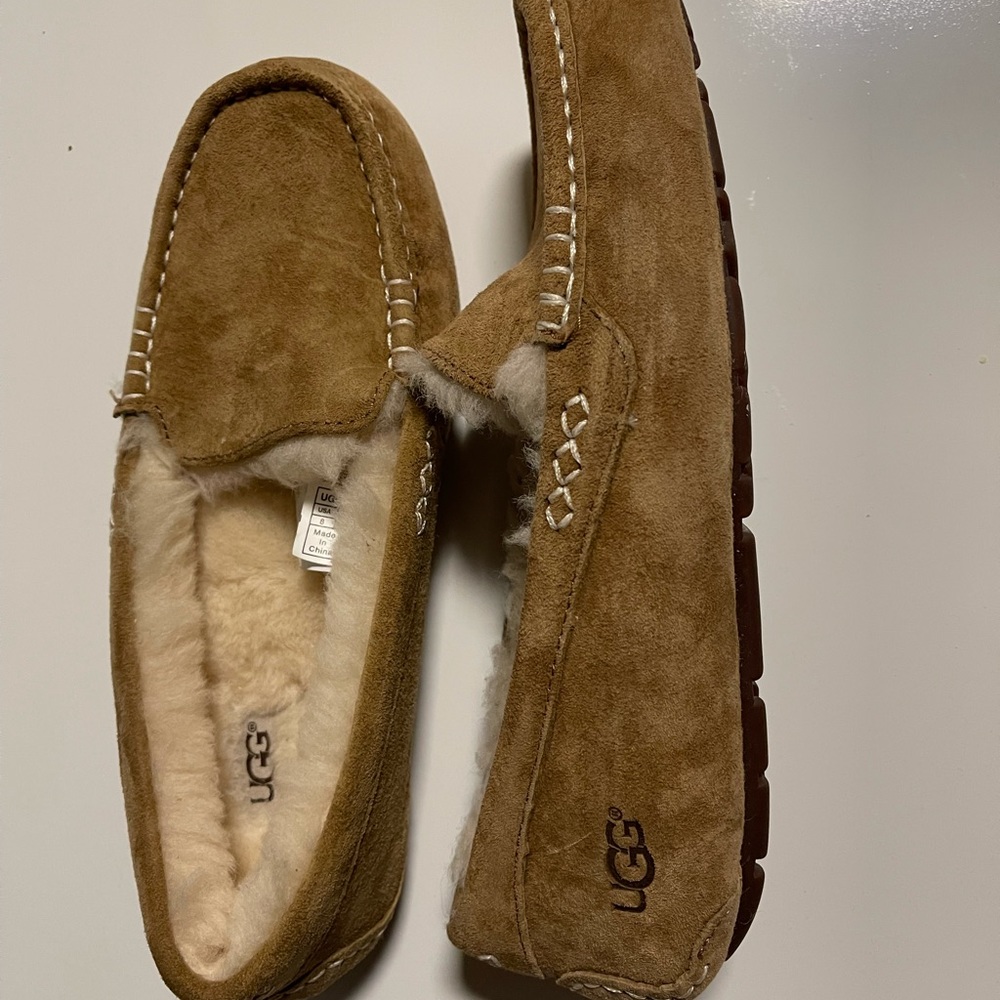 Ugg moccasin slippers. Tan suede with cream shearling inside.